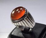 انگشتر عقیق پرتقالی یمنی تراشدار قطعی پایه نقره مدل خیاری اثر استاد حاج حسین جدی کد A-158 - تصویر 2
